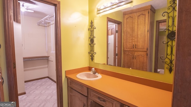 bathroom featuring vanity and baseboards