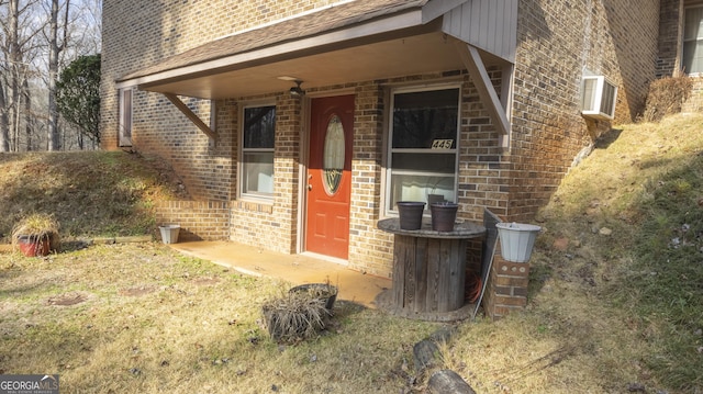 property entrance featuring brick siding