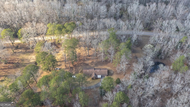 drone / aerial view featuring a forest view