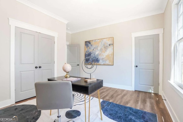 home office featuring baseboards, ornamental molding, and wood finished floors