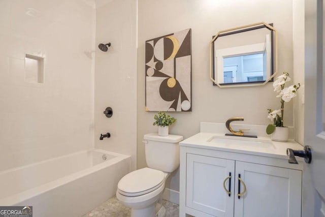 bathroom with baseboards, shower / bath combination, vanity, and toilet