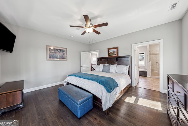 bedroom with visible vents, ensuite bathroom, dark wood-type flooring, a ceiling fan, and baseboards