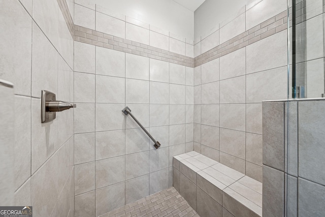 bathroom with a tile shower