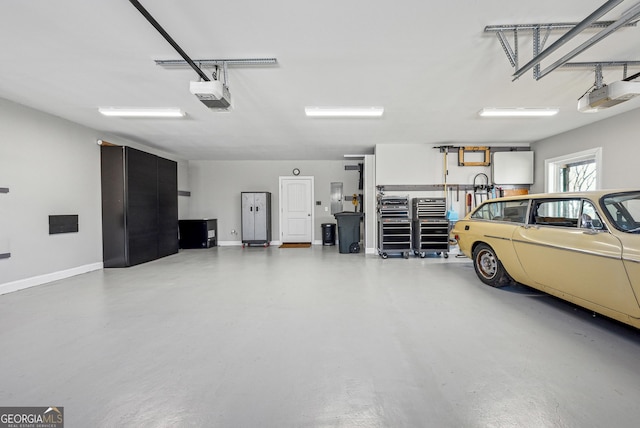 garage featuring baseboards and a garage door opener