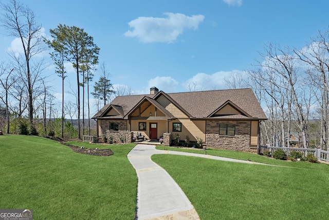 craftsman-style house featuring stone siding, a front lawn, a chimney, and roof with shingles