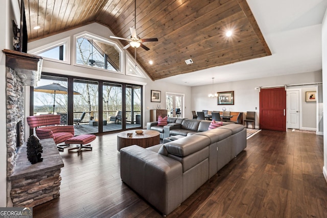 living area with high vaulted ceiling, wood ceiling, dark wood-style flooring, and a barn door