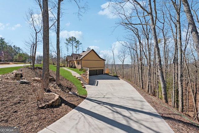 view of front facade featuring a garage and concrete driveway