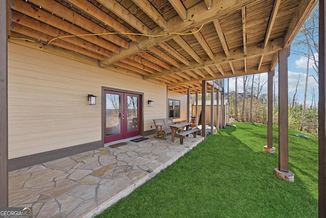 view of yard featuring french doors and a patio