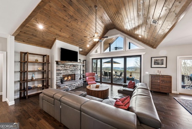 living area featuring wood ceiling, a wealth of natural light, dark wood finished floors, and a fireplace