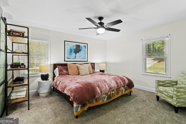 carpeted bedroom featuring ceiling fan and baseboards