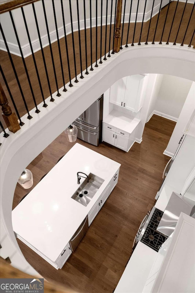 stairs featuring wood finished floors