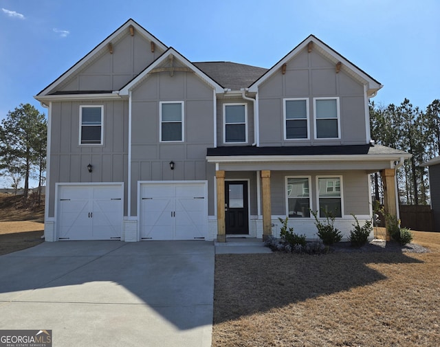 view of front of home with a garage, concrete driveway, and board and batten siding