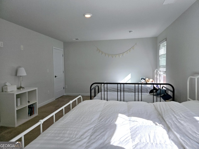 carpeted bedroom with baseboards