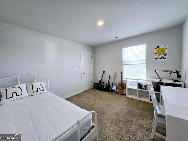 carpeted bedroom with baseboards and visible vents