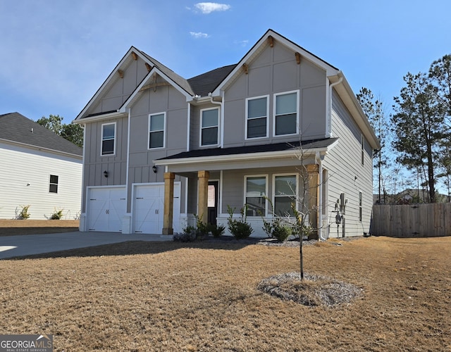 view of front of house with a garage, driveway, fence, a porch, and board and batten siding