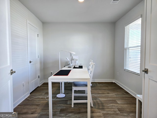 office featuring a healthy amount of sunlight, baseboards, and wood finished floors