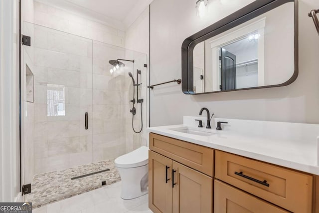 full bath with toilet, a stall shower, tile patterned floors, and vanity