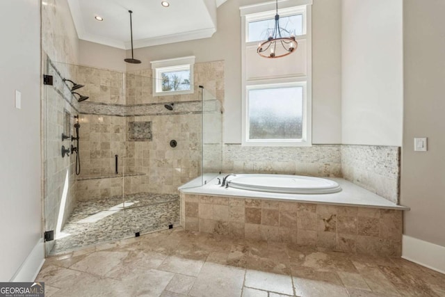 bathroom with a garden tub, baseboards, ornamental molding, a shower stall, and stone finish flooring