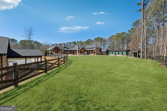 view of yard with fence and a gazebo