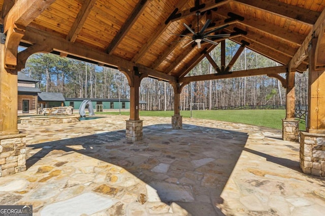 view of patio featuring a ceiling fan and a gazebo