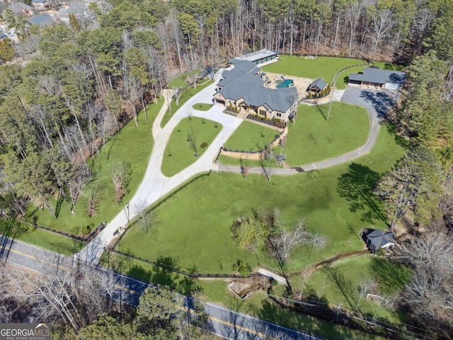 aerial view featuring a wooded view