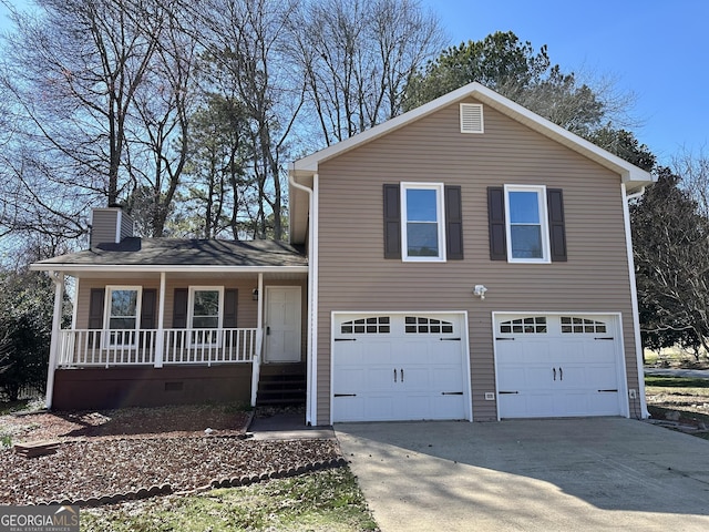 split level home with a chimney, a porch, concrete driveway, an attached garage, and crawl space