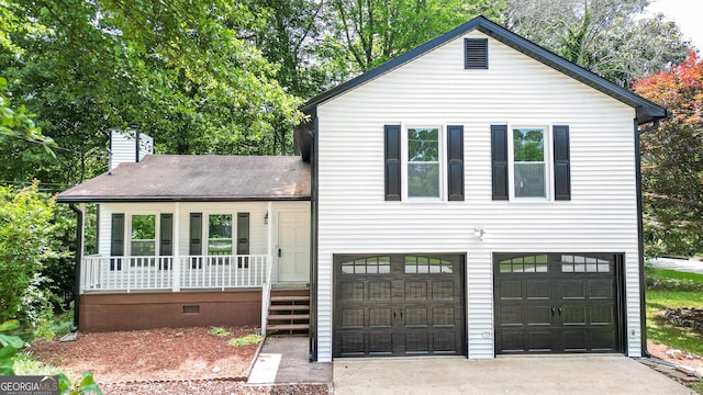 101 Summer Pond Trl, Lawrenceville, GA 30046 - split level home featuring covered porch, a garage, driveway, a chimney, and crawl space