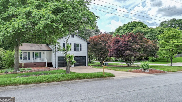 101 Summer Pond Trl, Lawrenceville, GA 30046 - view of front of home featuring driveway, a garage, crawl space, covered porch, and a front lawn
