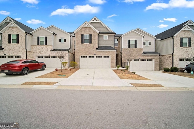 view of front of house with driveway, a garage, and brick siding