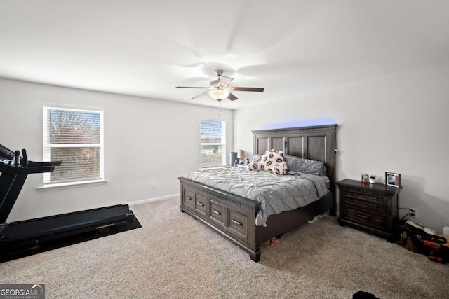 bedroom with carpet flooring, a ceiling fan, and baseboards