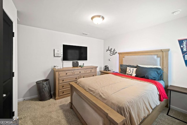 bedroom featuring carpet, visible vents, and baseboards