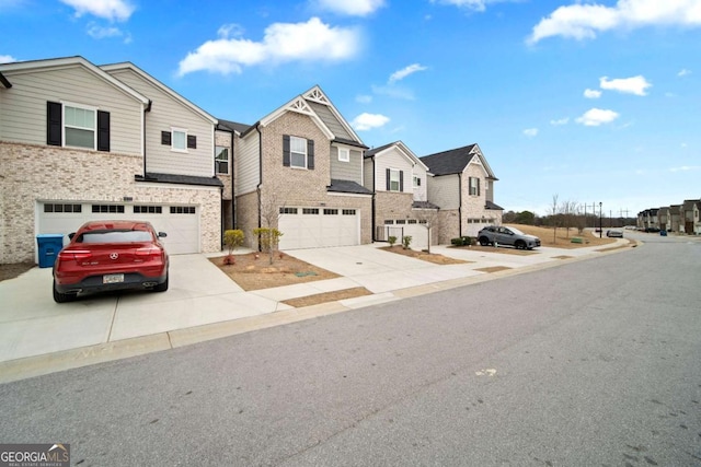 view of front of home featuring a residential view, concrete driveway, brick siding, and an attached garage