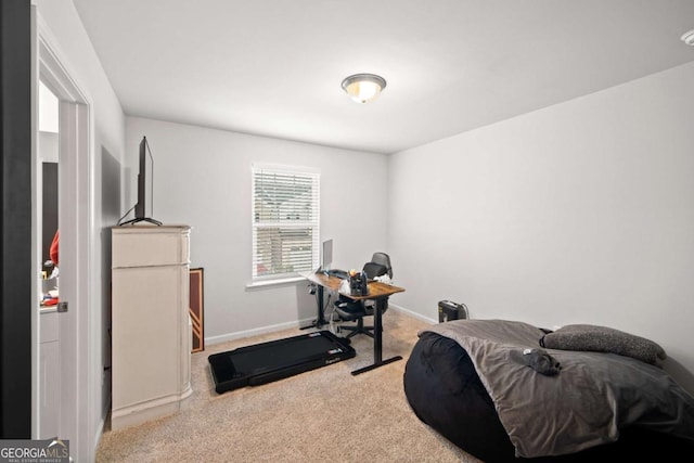 exercise room featuring carpet and baseboards