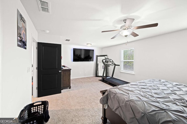 bedroom featuring a ceiling fan, baseboards, visible vents, and carpet flooring