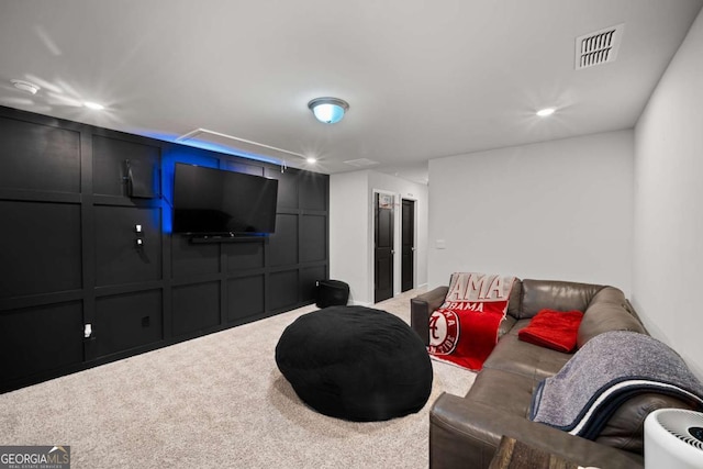 cinema room with recessed lighting, carpet flooring, visible vents, and a decorative wall