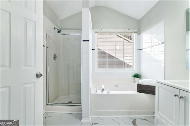 full bath with lofted ceiling, marble finish floor, a stall shower, and a bath