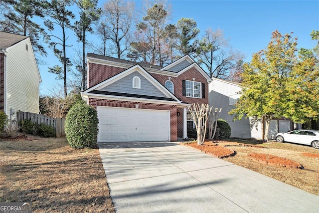 view of front facade with an attached garage, fence, concrete driveway, and brick siding