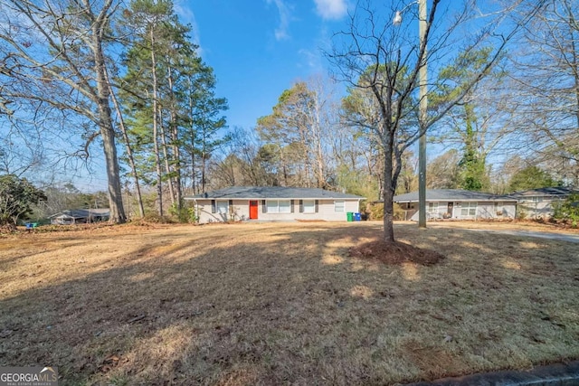 ranch-style house with a front lawn