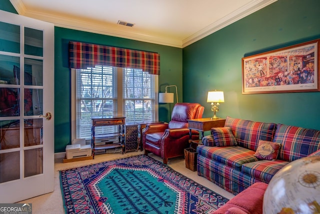 carpeted living room featuring ornamental molding and visible vents