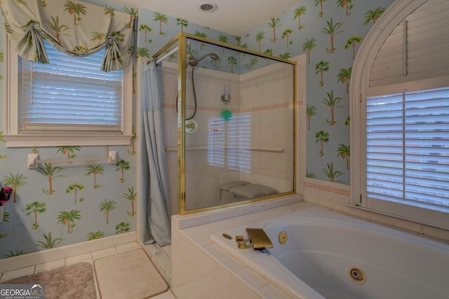 bathroom with a whirlpool tub, a shower stall, and wallpapered walls