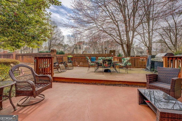 wooden deck featuring outdoor dining space and area for grilling