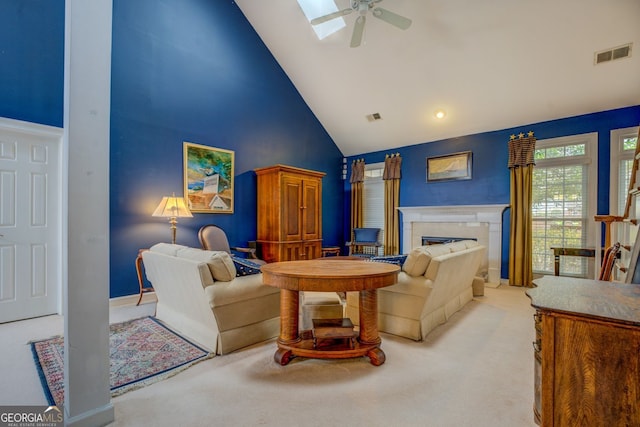 living room featuring high vaulted ceiling, visible vents, a fireplace, and light carpet