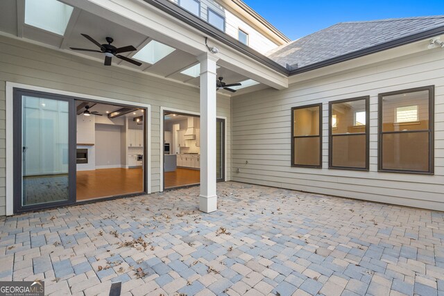 interior space featuring an inviting chandelier, beam ceiling, baseboards, and wood finished floors