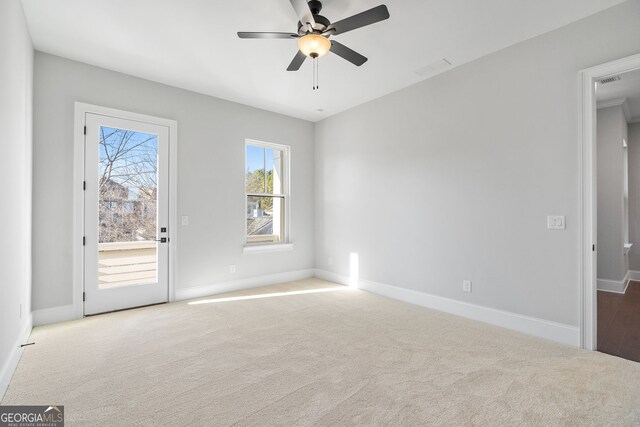 hall featuring baseboards, ornamental molding, wood finished floors, and an upstairs landing