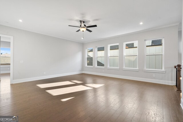 corridor featuring wood finished floors, visible vents, baseboards, an upstairs landing, and crown molding