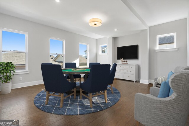 unfurnished living room with ornamental molding, visible vents, baseboards, and wood finished floors