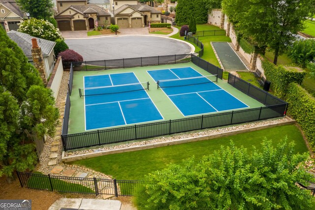 community pool featuring fence and a patio