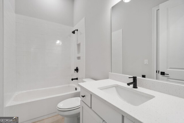 bathroom featuring shower / tub combination, vanity, and toilet