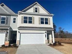 view of front facade featuring driveway and a garage