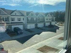 view of front of house featuring a residential view and an attached garage